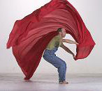 Theron waving red fabric